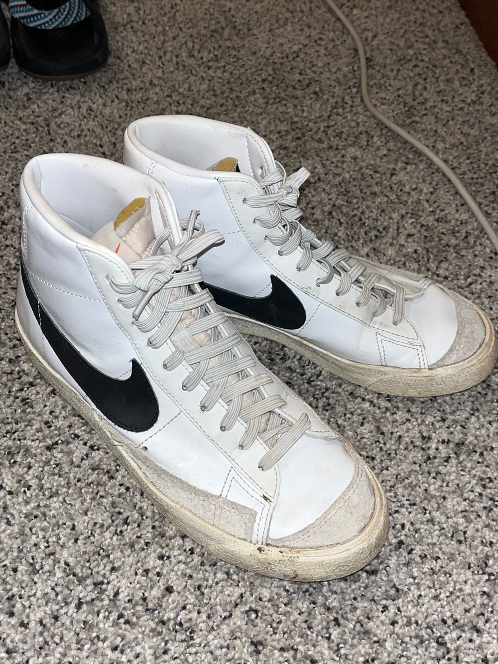 Nike White High-Top Sneakers with Black Swoosh
